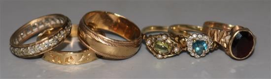 Six assorted 9ct gold rings including gem set and two bands.